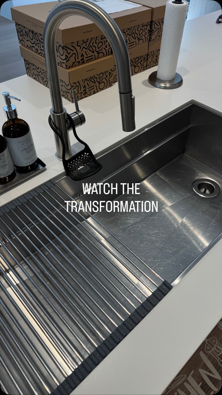 Polished stainless steel kitchen sink